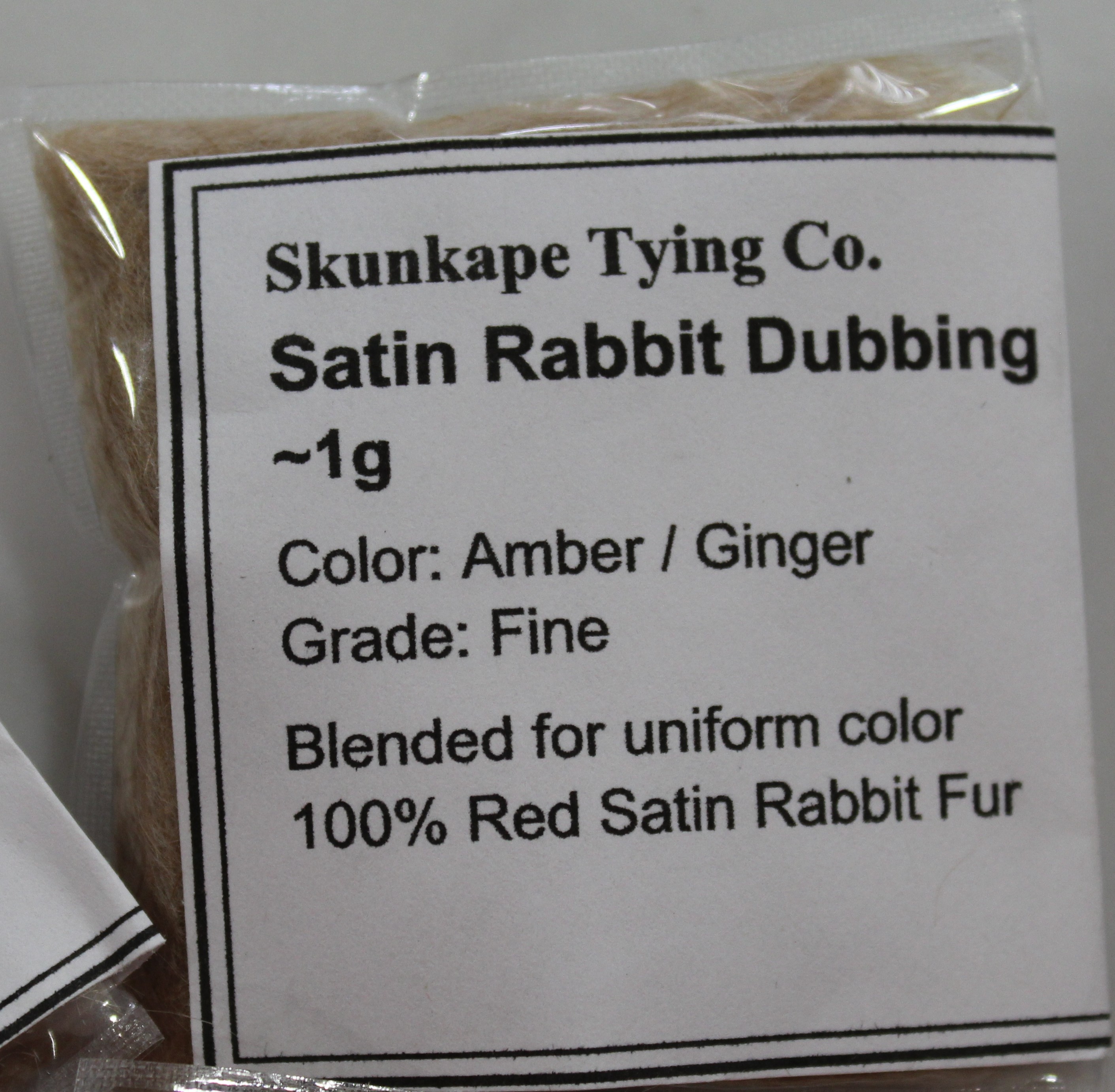 Amber Satin Rabbit Dubbing packaged and labeled for sale.